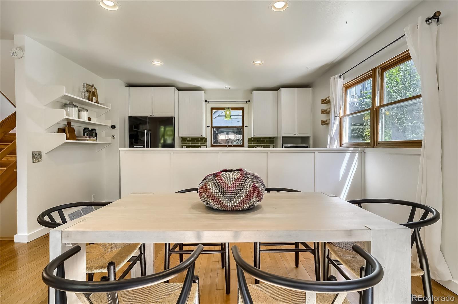 4150 Riverside Avenue Boulder, CO 80304 - Photo 7 of 35 a kitchen with a table chairs stove and microwave