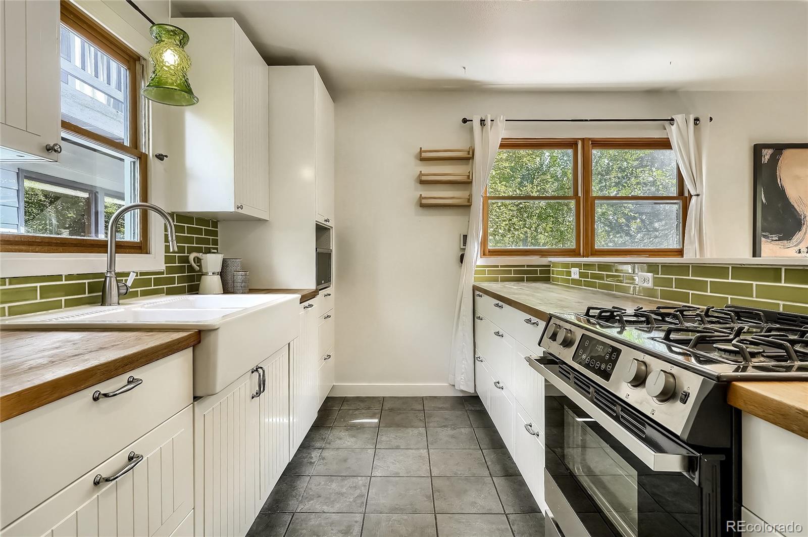 4150 Riverside Avenue Boulder, CO 80304 - Photo 8 of 35 a kitchen with stainless steel appliances granite countertop a stove and a sink