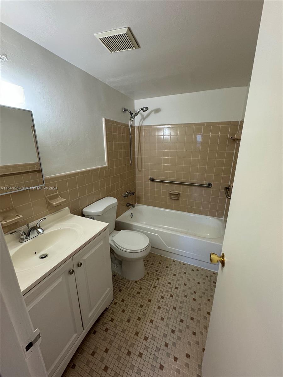 4080 Southwest 2nd Terrace, Unit 2 Miami, FL 33134 - Photo 15 of 19 a bathroom with a sink a toilet and shower