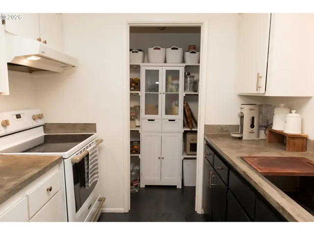 a kitchen with cabinets and appliances