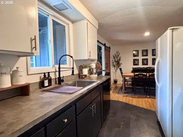 a kitchen with counter top space cabinets and stainless steel appliances