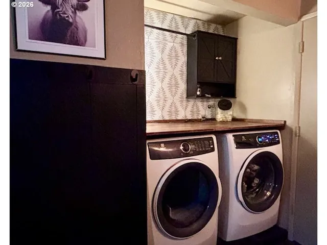 a utility room with dryer and washer