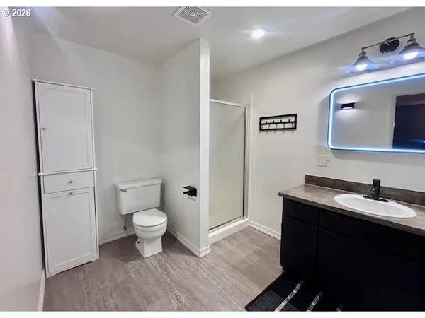 a room with a piano and wooden floor