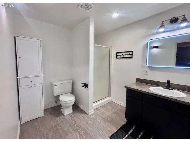 a room with a piano and wooden floor