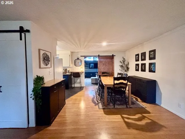 a living room with furniture window and wooden floor