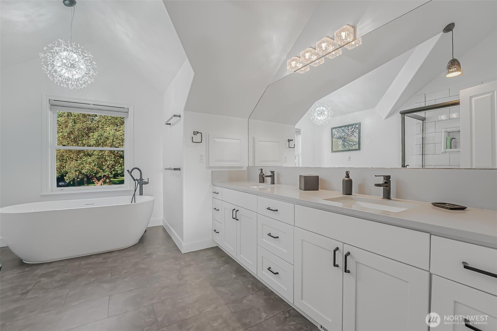 528 Waynes Ridge Circle Camano Island, WA 98282 - Photo 22 of 40 a spacious bathroom with a double vanity sink a large mirror a bathtub and window