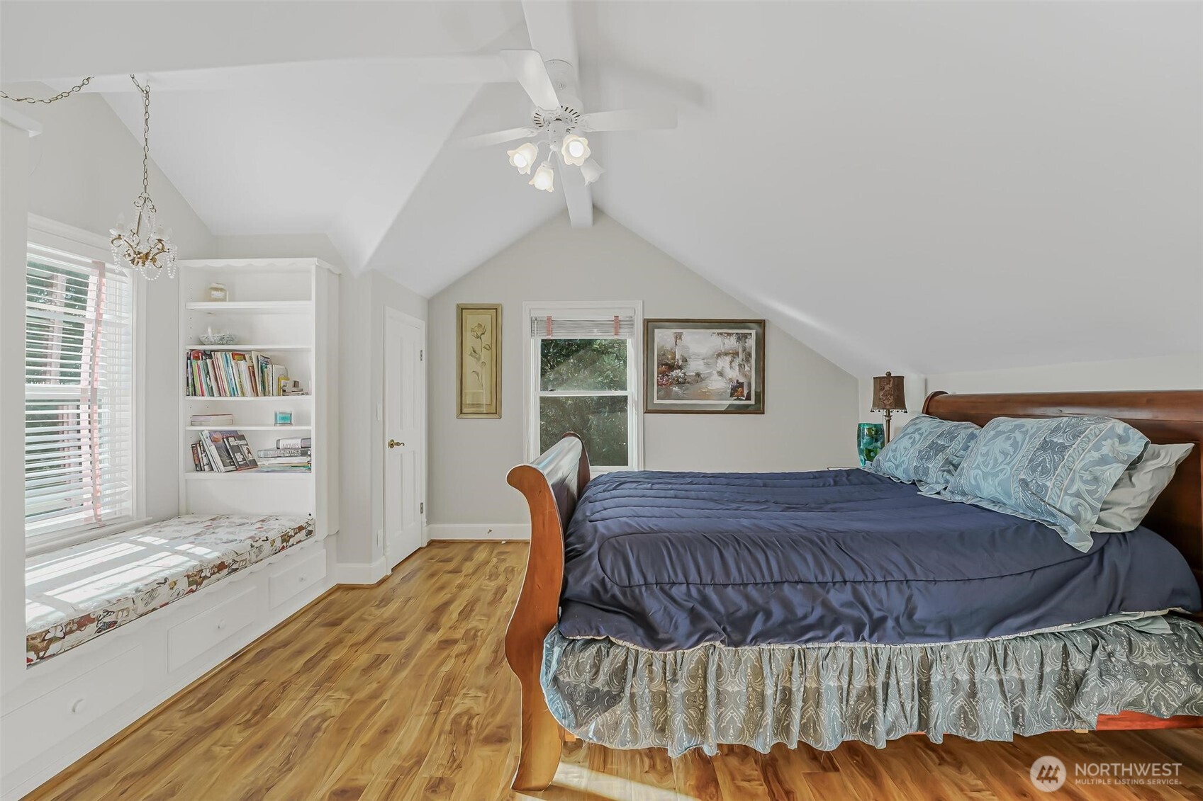 528 Waynes Ridge Circle Camano Island, WA 98282 - Photo 26 of 40 a bedroom with a large bed and a chandelier