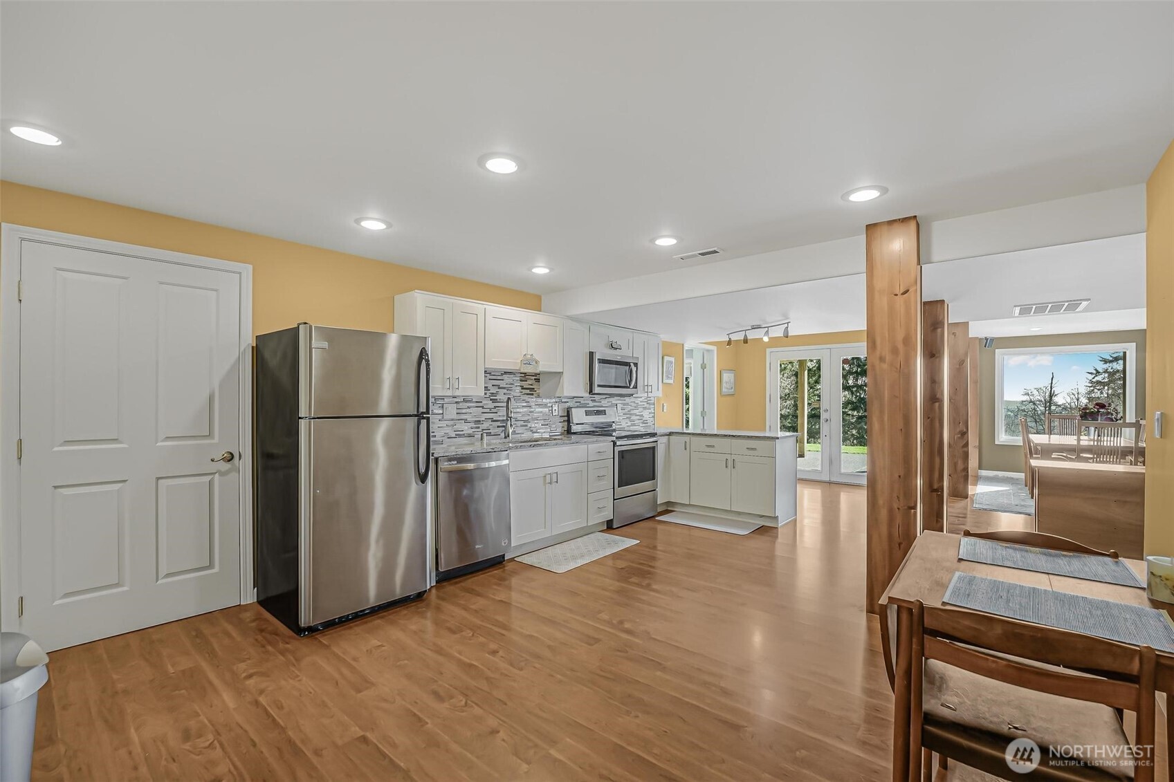 528 Waynes Ridge Circle Camano Island, WA 98282 - Photo 27 of 40 a kitchen with white cabinets and refrigerator
