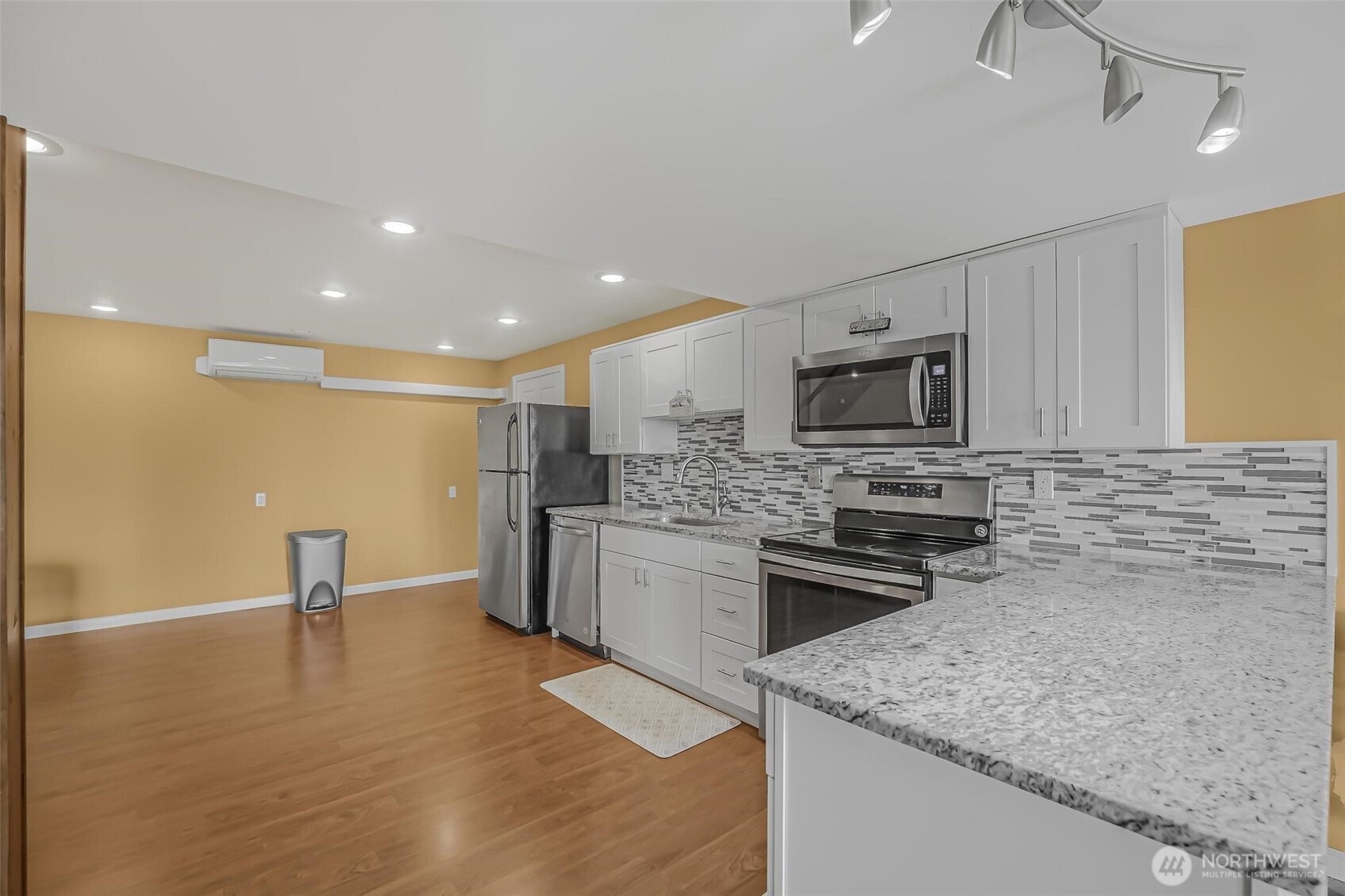 528 Waynes Ridge Circle Camano Island, WA 98282 - Photo 28 of 40 a kitchen with a sink a stove a microwave and cabinets