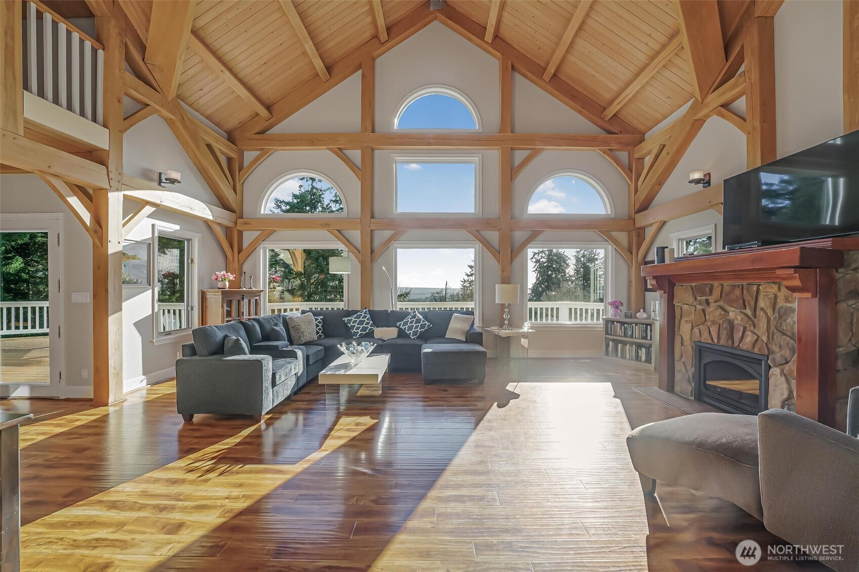 528 Waynes Ridge Circle Camano Island, WA 98282 - Photo 4 of 40 a living room with fireplace furniture and a large window
