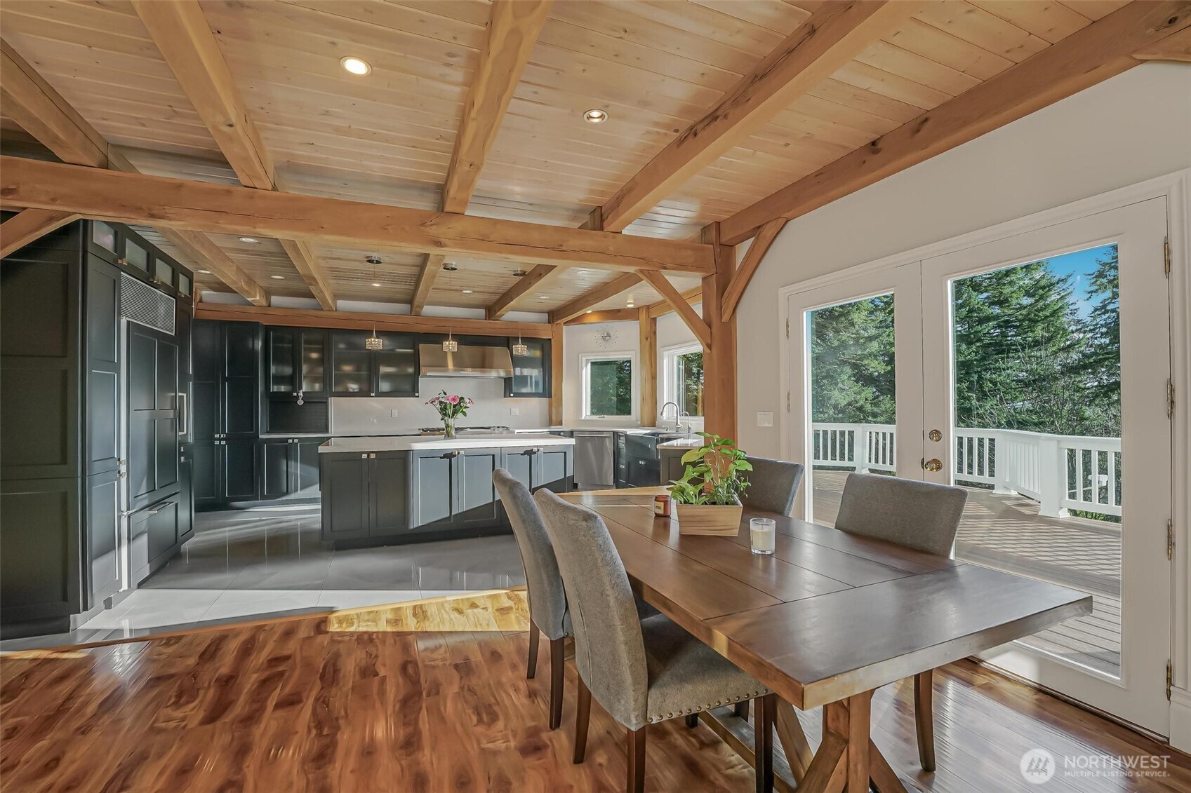 528 Waynes Ridge Circle Camano Island, WA 98282 - Photo 8 of 40 a dining room with stainless steel appliances granite countertop a table chairs and a microwave
