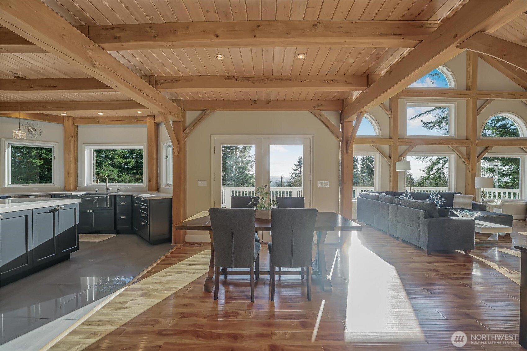 528 Waynes Ridge Circle Camano Island, WA 98282 - Photo 9 of 40 a view of a dining room with furniture wooden floor and chandelier
