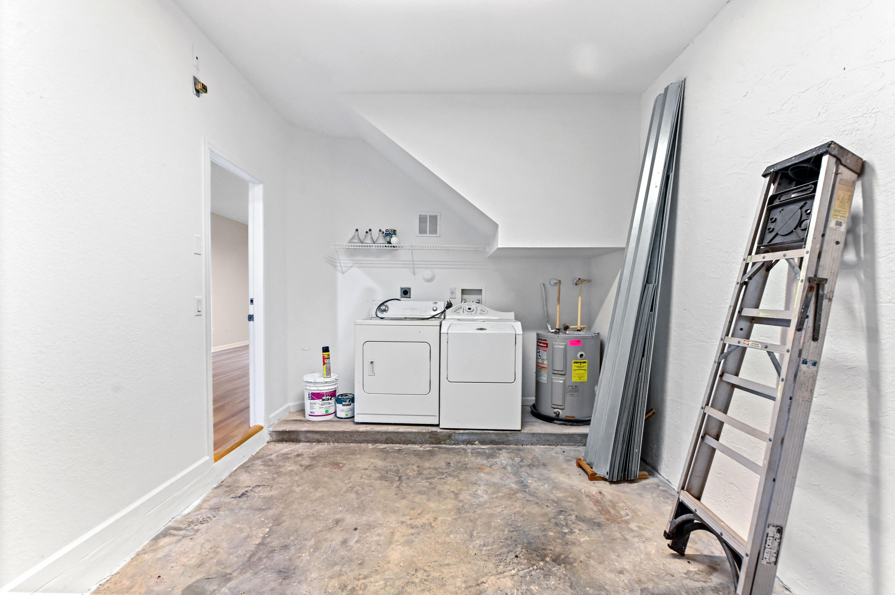 975 Tortuga Drive Riviera Beach, FL 33404 - Photo 13 of 29 a view of a storage & utility room with stuff