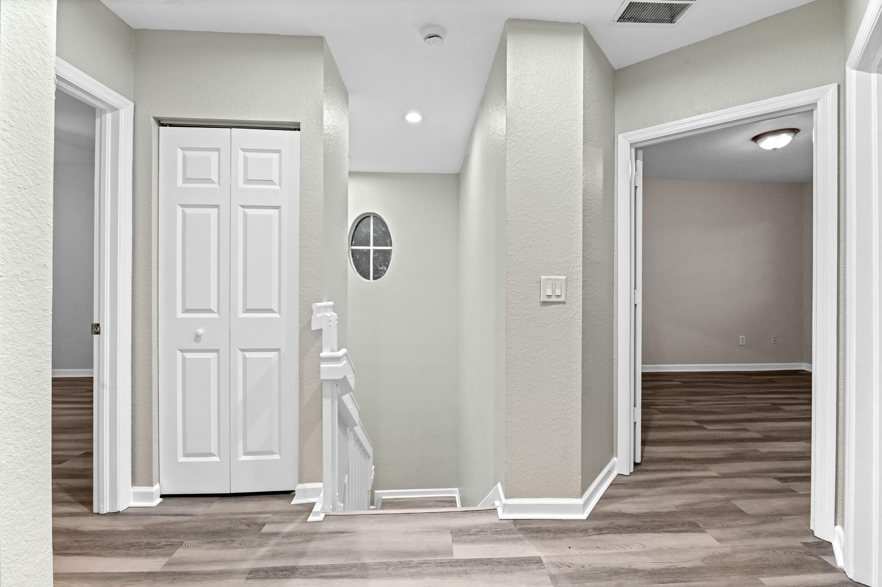 975 Tortuga Drive Riviera Beach, FL 33404 - Photo 14 of 29 an empty room with wooden floor and entryway