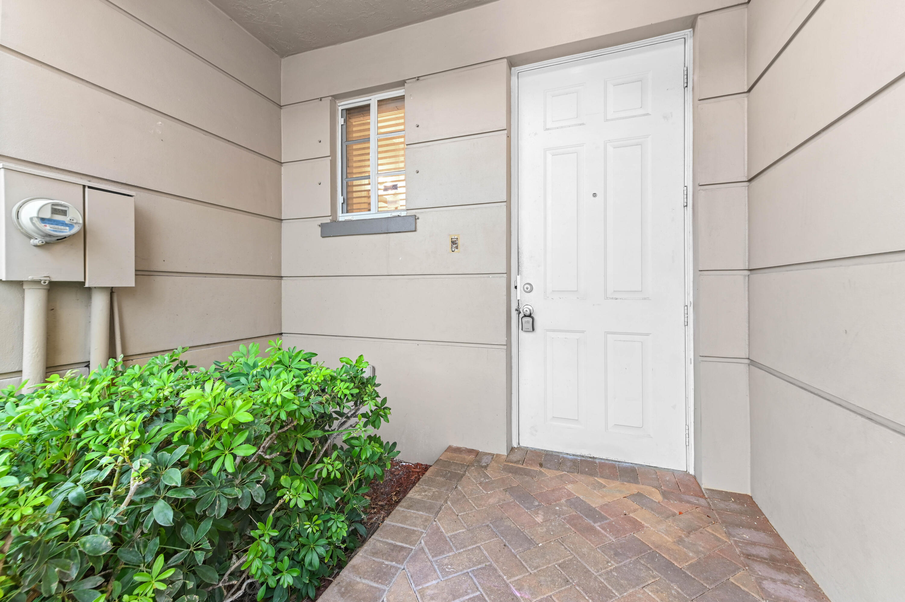 975 Tortuga Drive Riviera Beach, FL 33404 - Photo 29 of 29 a view of backyard and garage