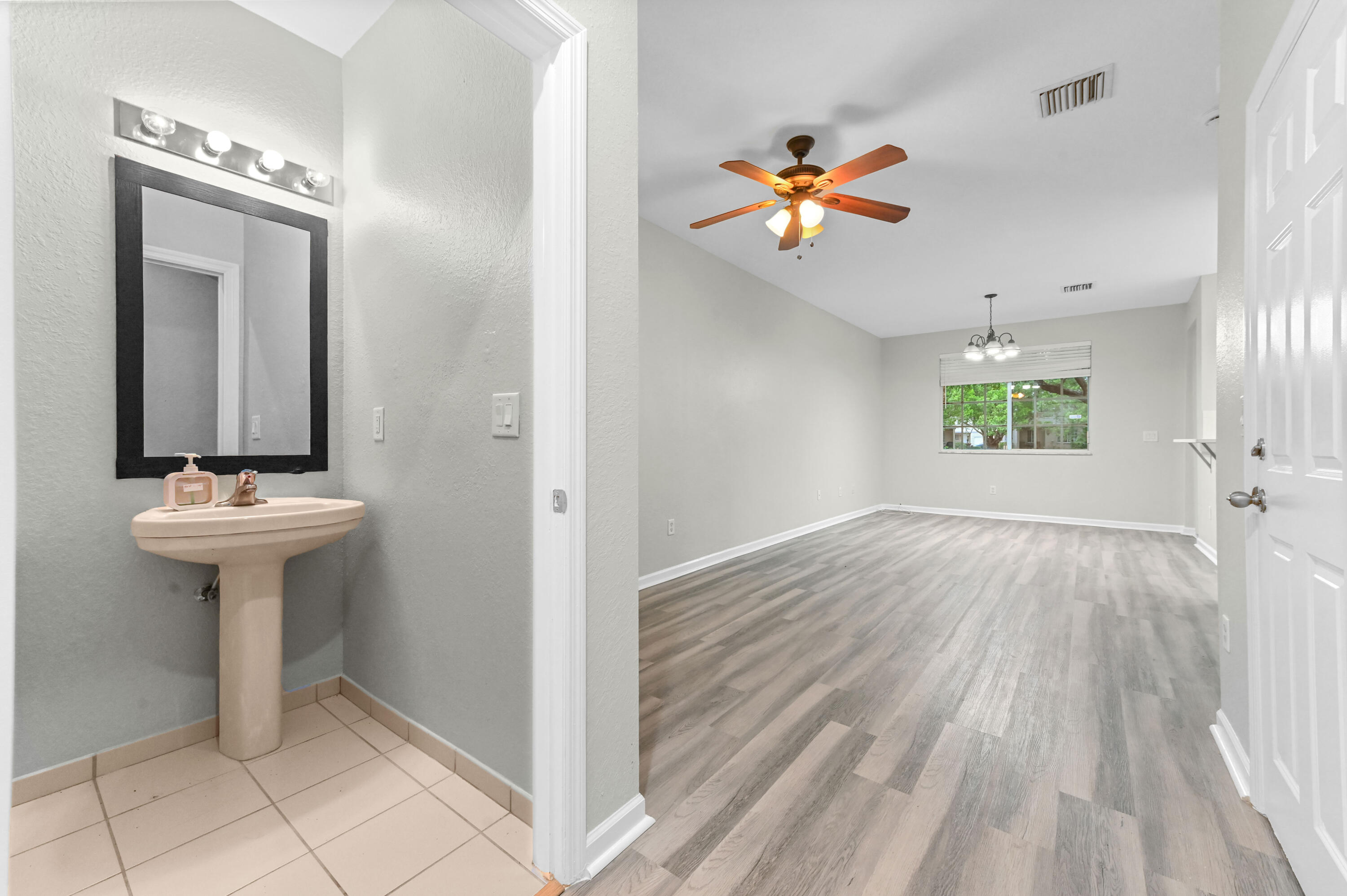 975 Tortuga Drive Riviera Beach, FL 33404 - Photo 3 of 29 a view of an entryway with wooden floor