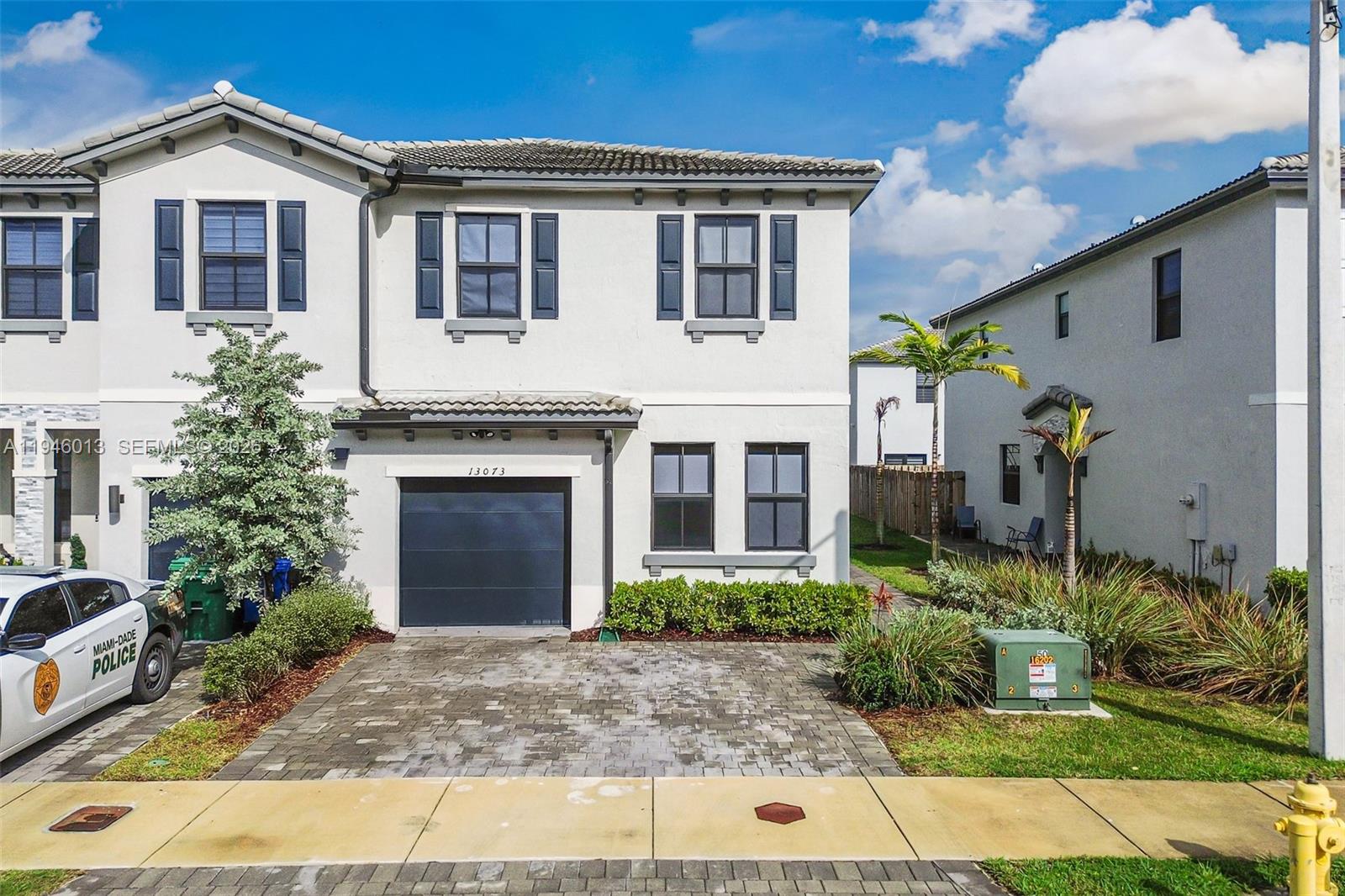 13073 Southwest 286th Street Homestead, FL 33033 - Photo 1 of 53 a front view of a house with a yard and potted plants