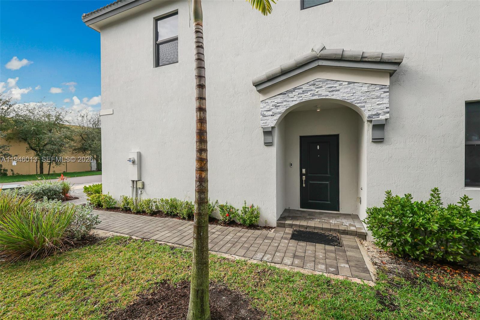 13073 Southwest 286th Street Homestead, FL 33033 - Photo 19 of 53 a front view of a house with garden