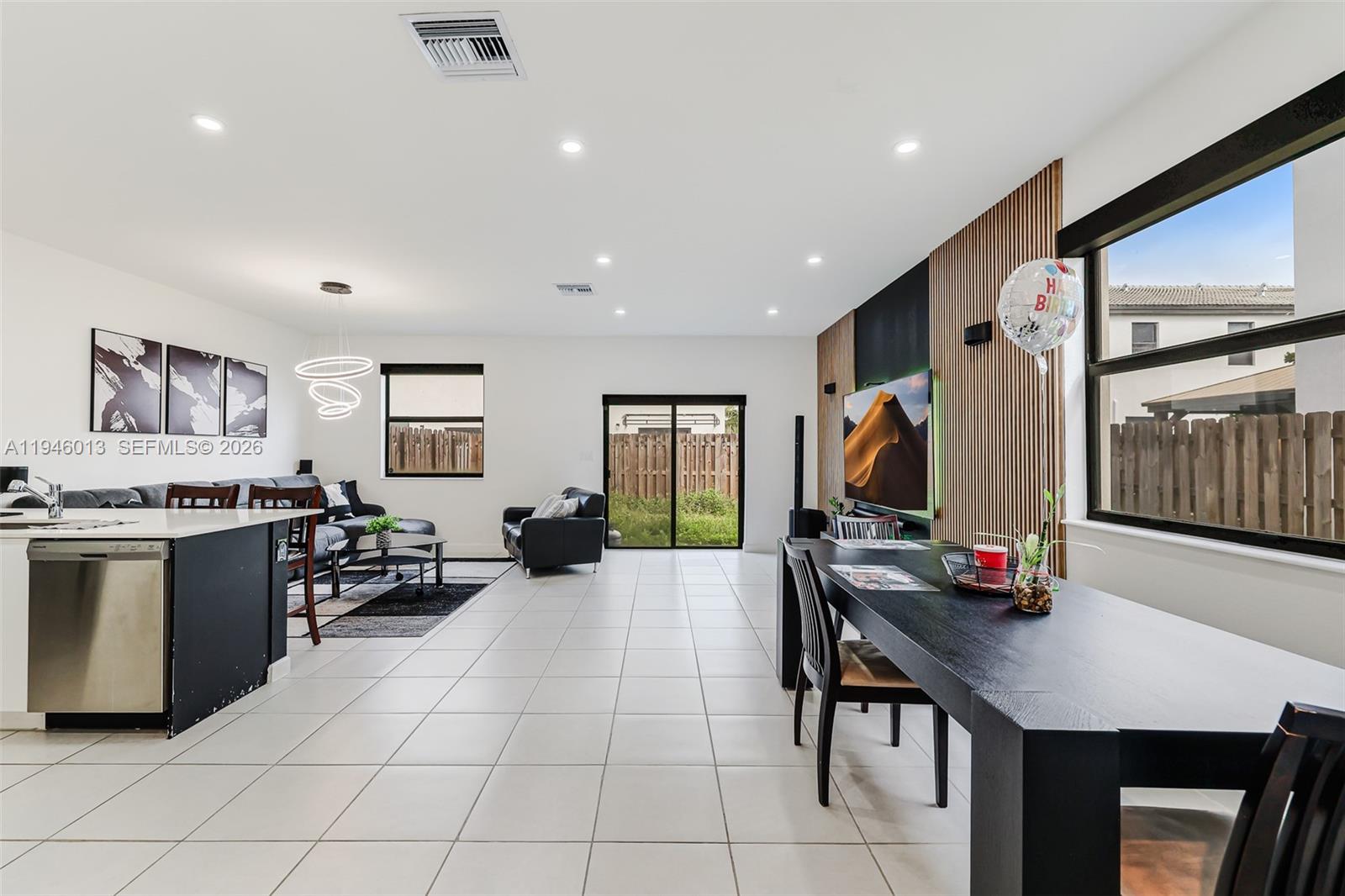 13073 Southwest 286th Street Homestead, FL 33033 - Photo 21 of 53 a kitchen with stainless steel appliances a sink stove and cabinets