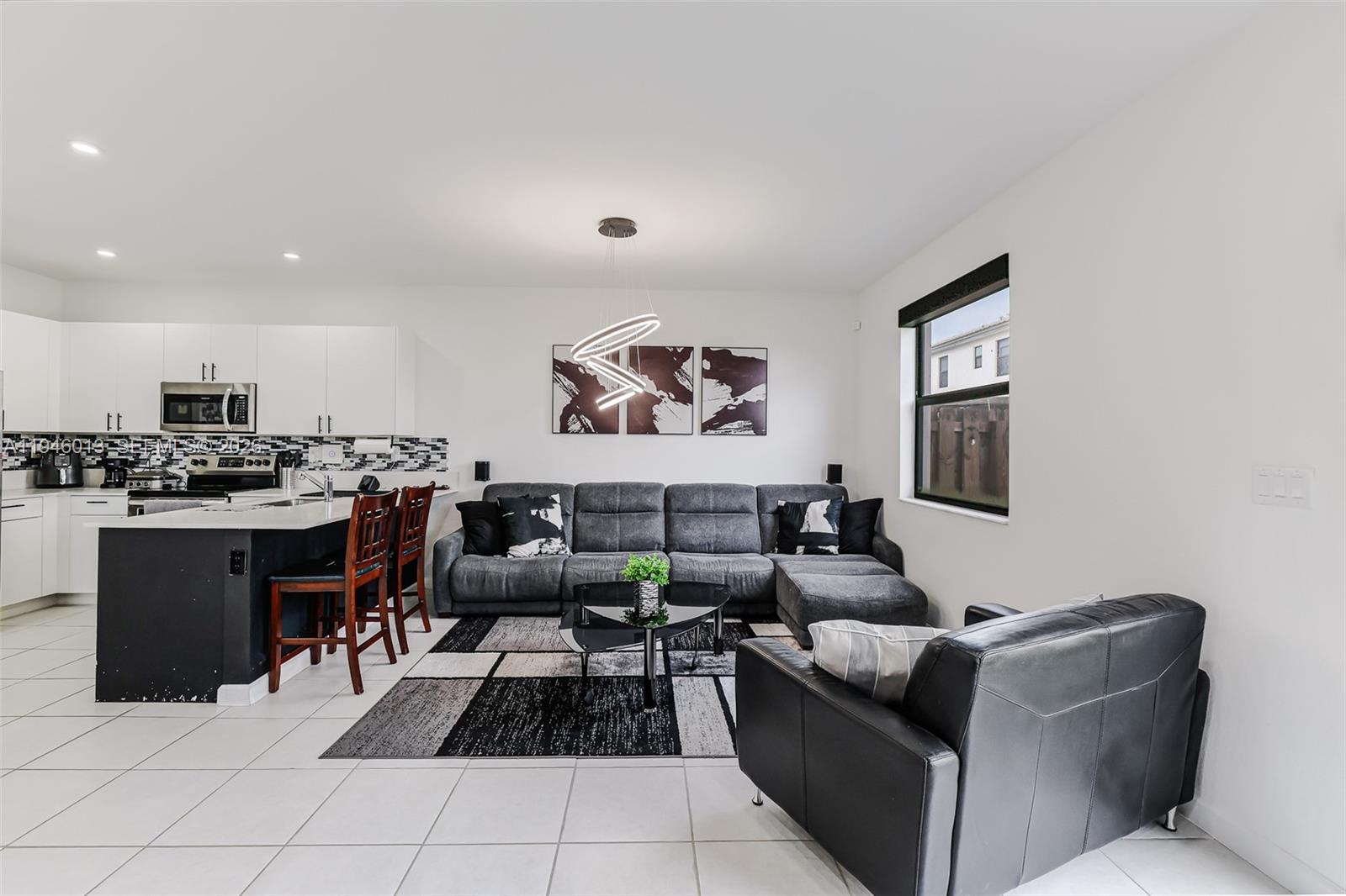 13073 Southwest 286th Street Homestead, FL 33033 - Photo 26 of 53 a living room with furniture and kitchen view