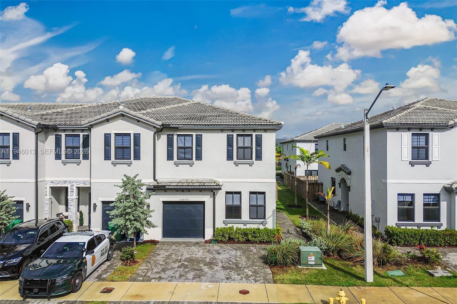13073 Southwest 286th Street Homestead, FL 33033 - Photo 3 of 53 a front view of a house with a yard