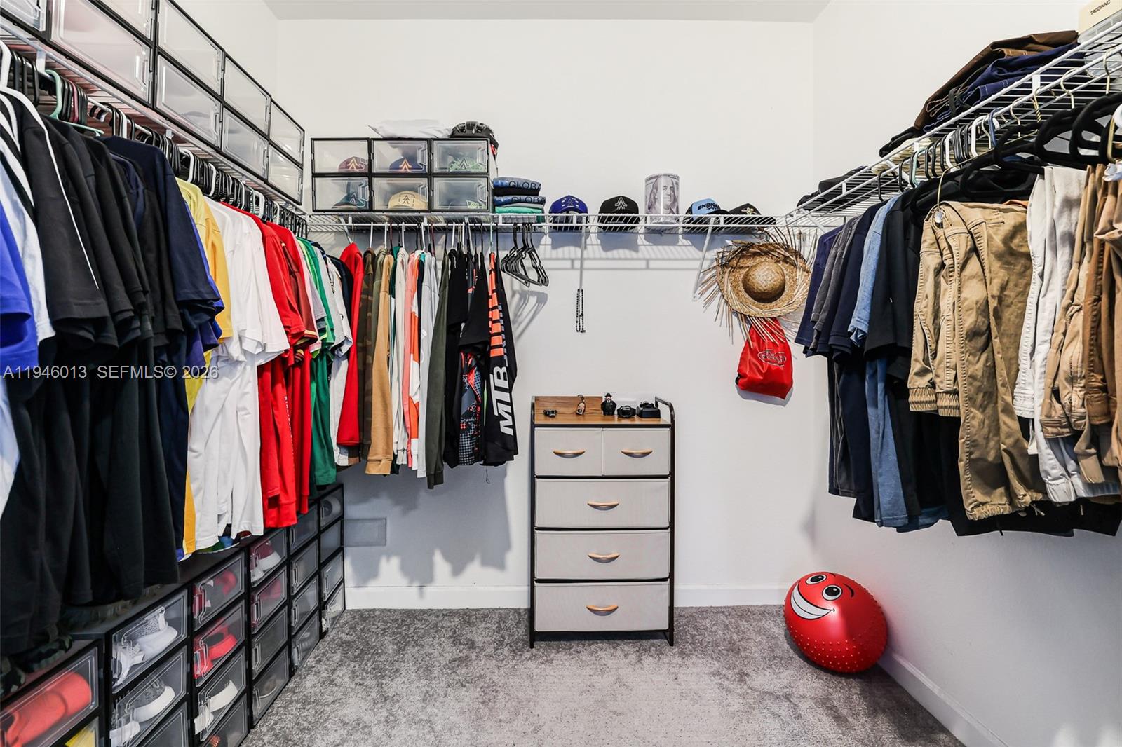 13073 Southwest 286th Street Homestead, FL 33033 - Photo 34 of 53 a view of walk in closet with clothes and shoes