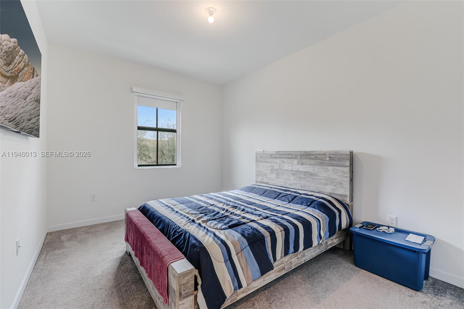 13073 Southwest 286th Street Homestead, FL 33033 - Photo 35 of 53 a bedroom with a bed and a window