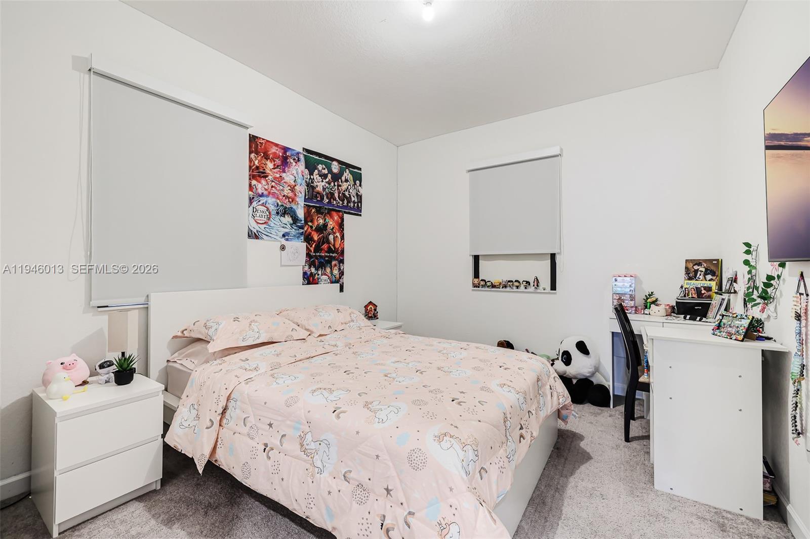 13073 Southwest 286th Street Homestead, FL 33033 - Photo 38 of 53 a bedroom with a bed and a couch