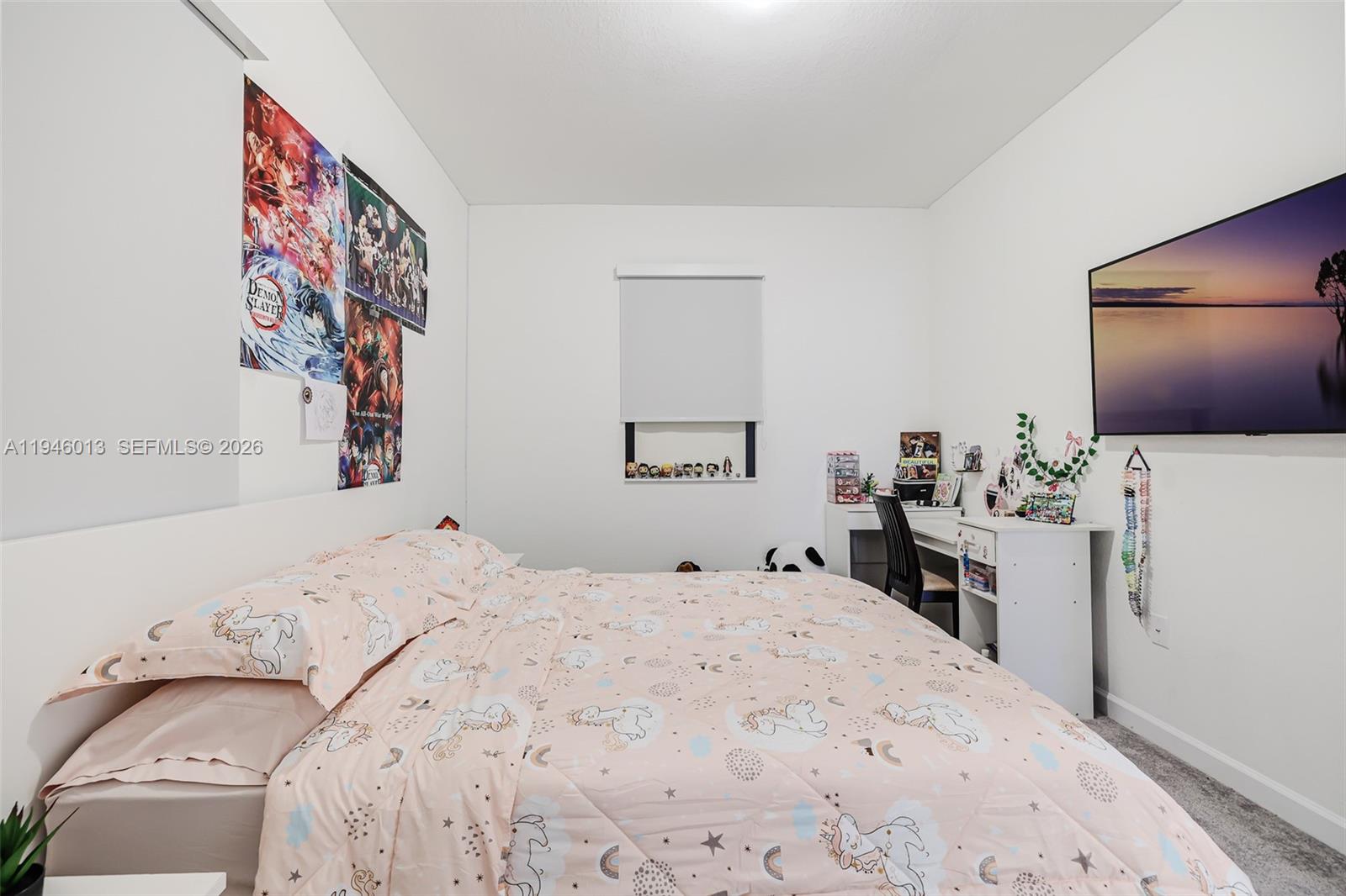 13073 Southwest 286th Street Homestead, FL 33033 - Photo 39 of 53 a bedroom with a bed and a flat screen tv