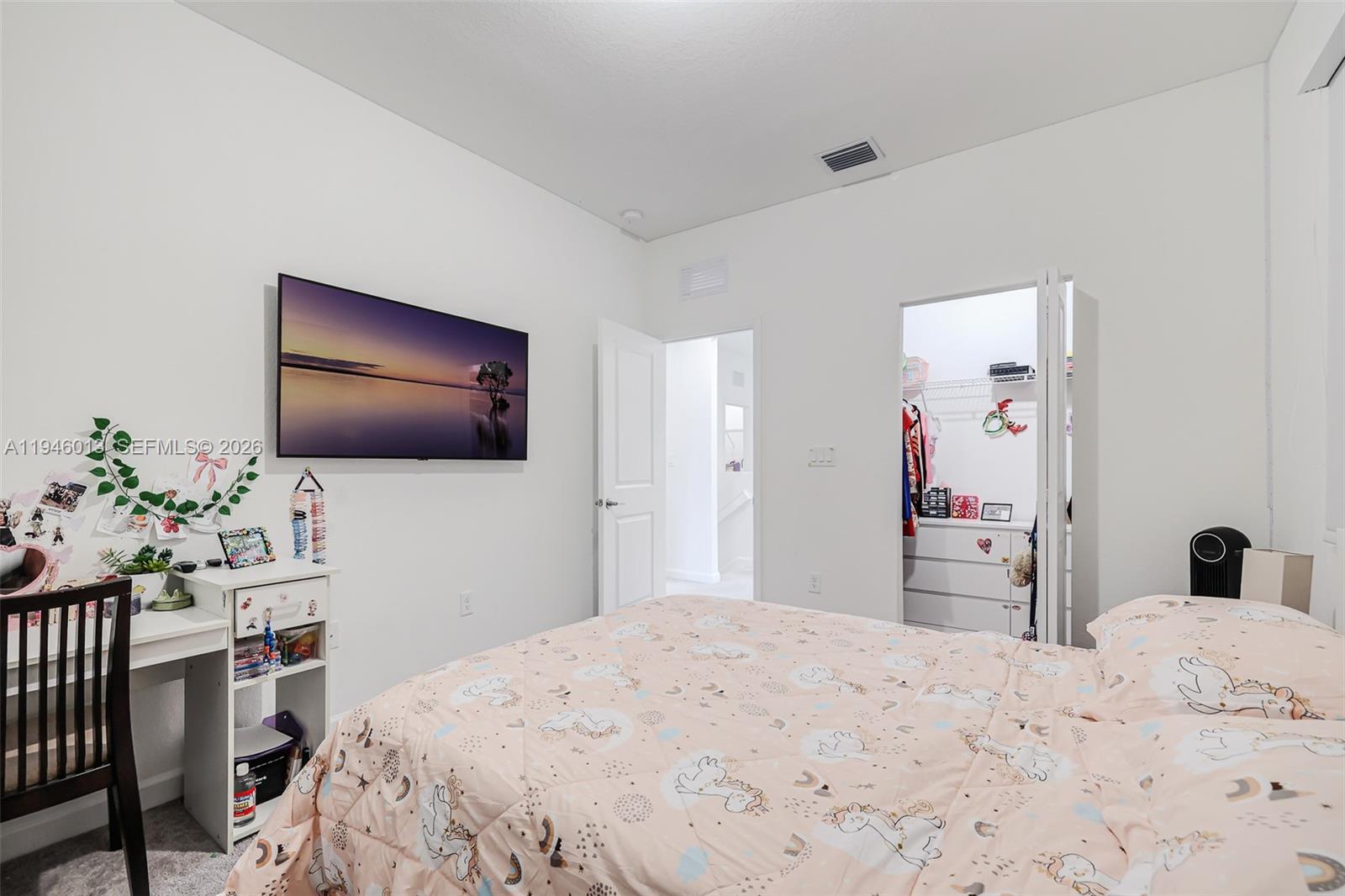 13073 Southwest 286th Street Homestead, FL 33033 - Photo 40 of 53 a bedroom with a bed and a flat screen tv