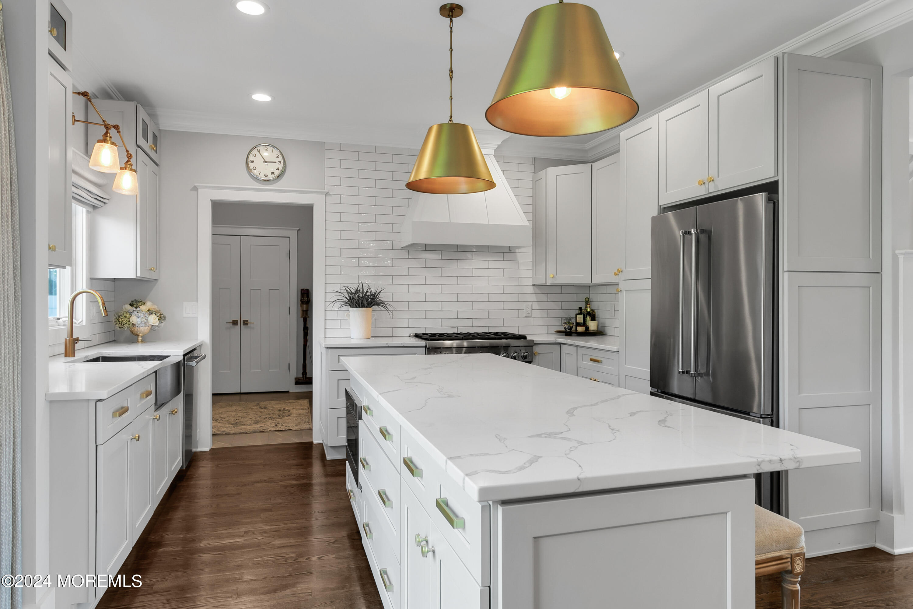 27 Center Street Rumson, NJ 07760 - Photo 12 of 57 a kitchen that has a lot of white cabinets and stainless steel appliances