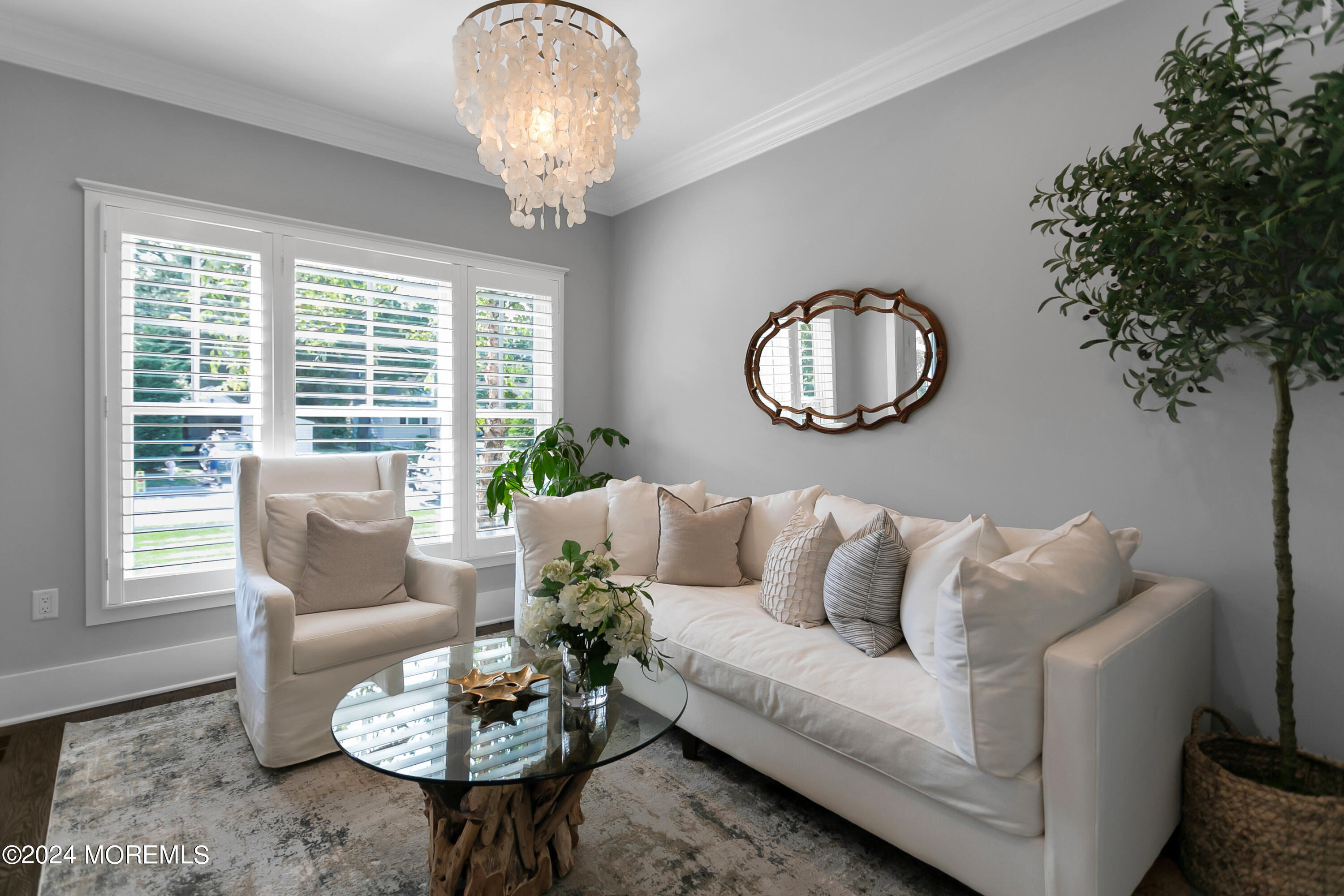 27 Center Street Rumson, NJ 07760 - Photo 18 of 57 a living room with furniture and a large window