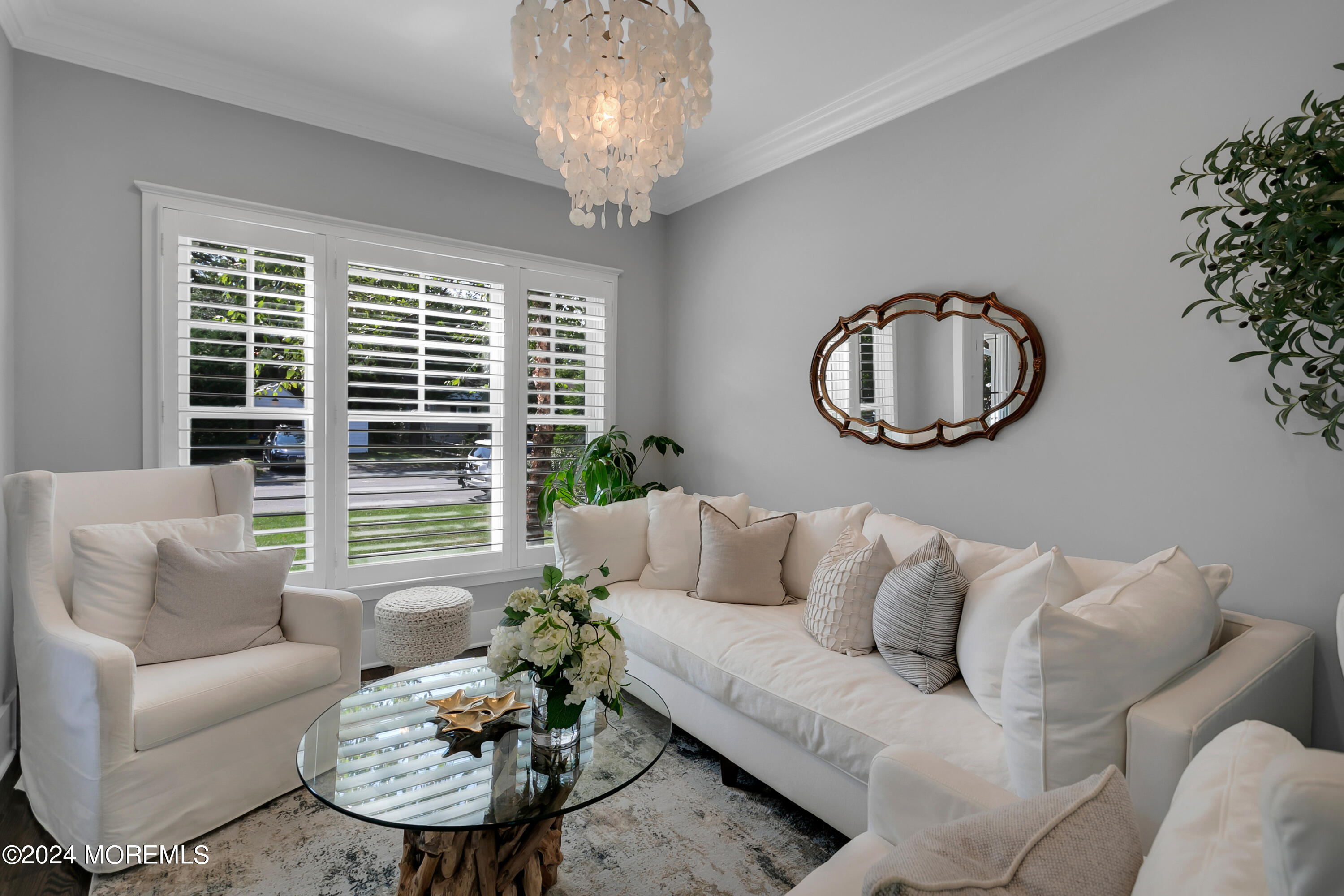 27 Center Street Rumson, NJ 07760 - Photo 21 of 57 a living room with furniture and a large window
