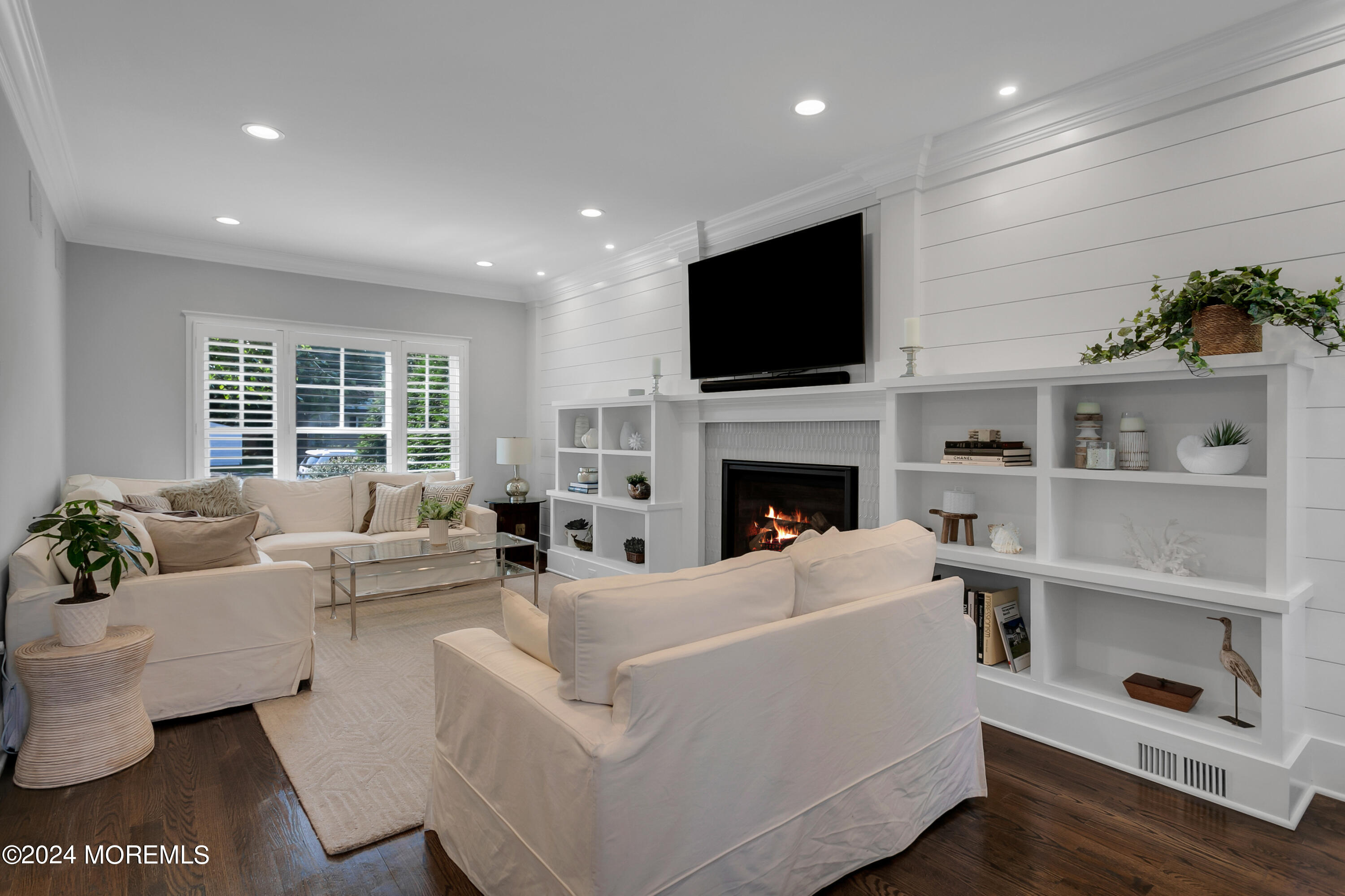 27 Center Street Rumson, NJ 07760 - Photo 22 of 57 a living room with furniture fireplace and a flat screen tv