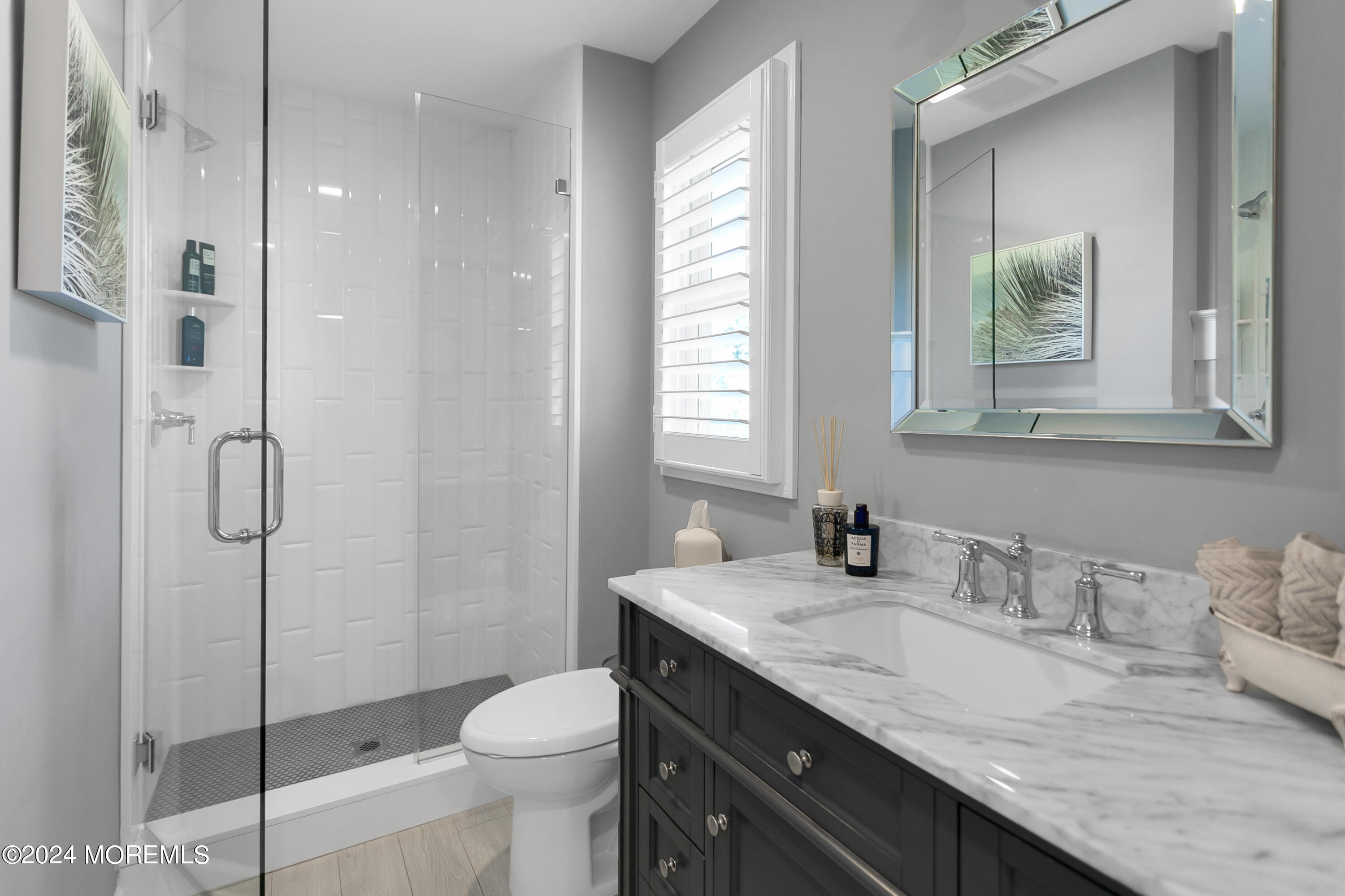 27 Center Street Rumson, NJ 07760 - Photo 36 of 57 a bathroom with a granite countertop sink toilet and shower