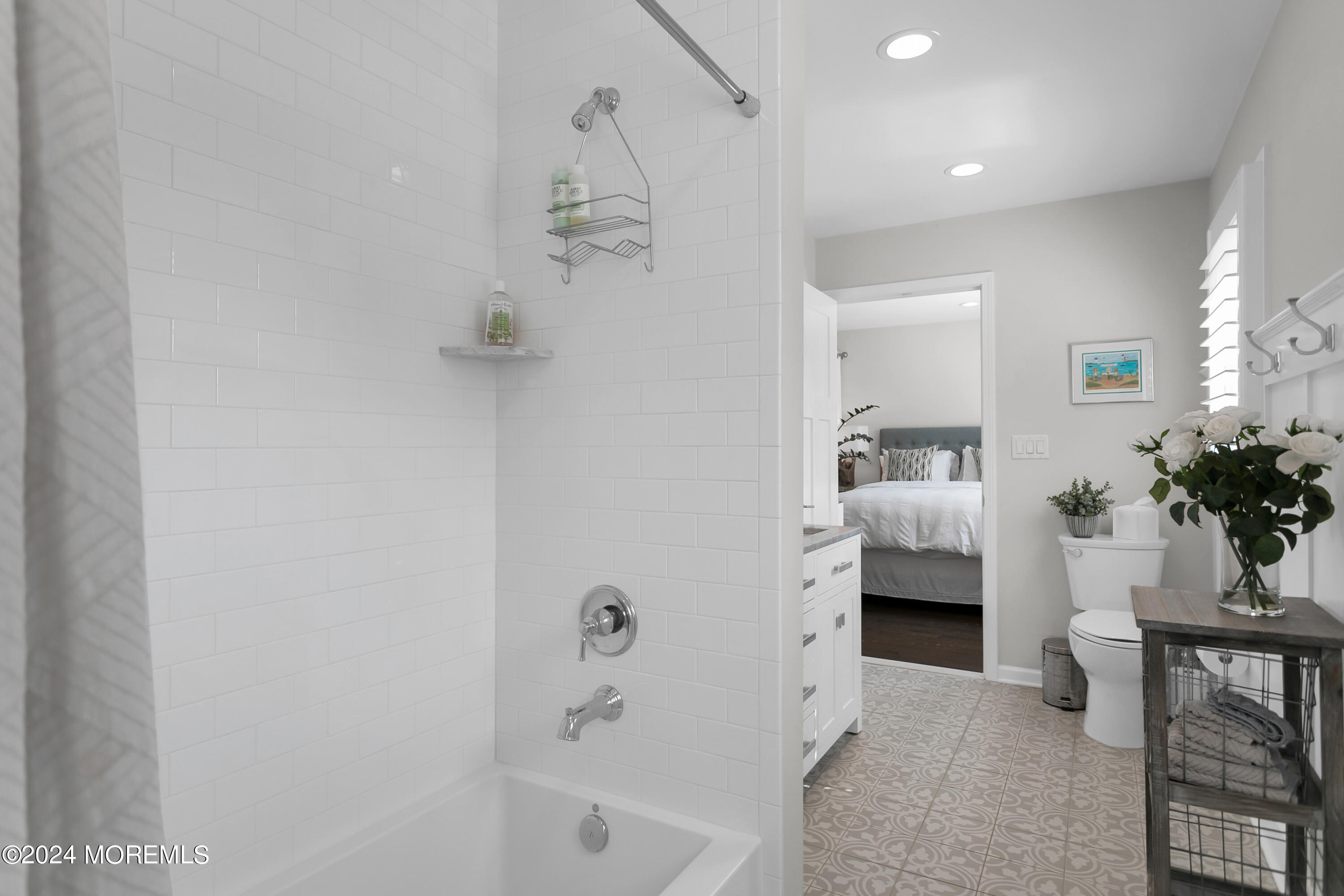 27 Center Street Rumson, NJ 07760 - Photo 38 of 57 a en suite bathroom with a sink and a mirror