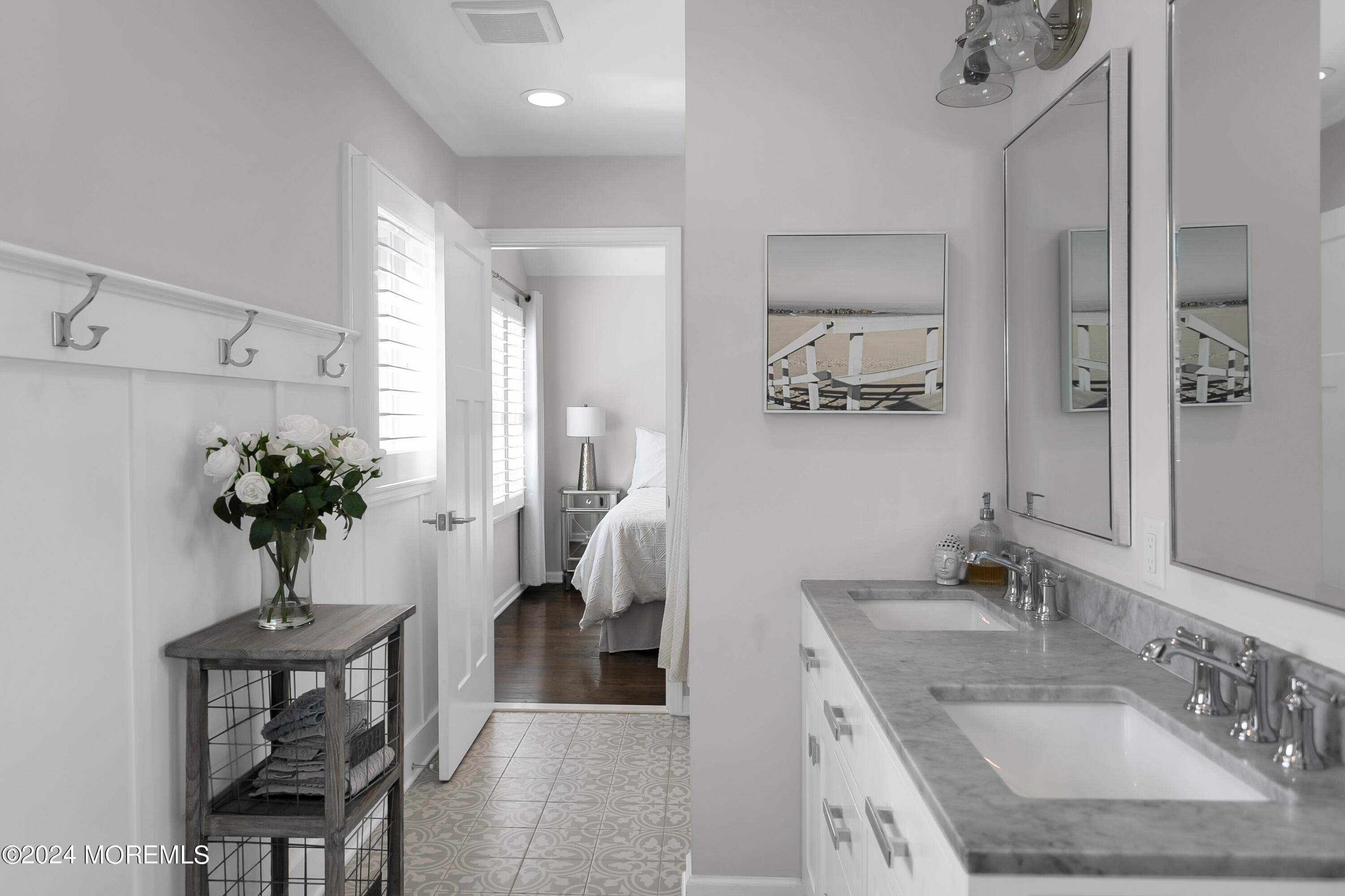 27 Center Street Rumson, NJ 07760 - Photo 39 of 57 a en suite bathroom with a granite countertop sink and a mirror