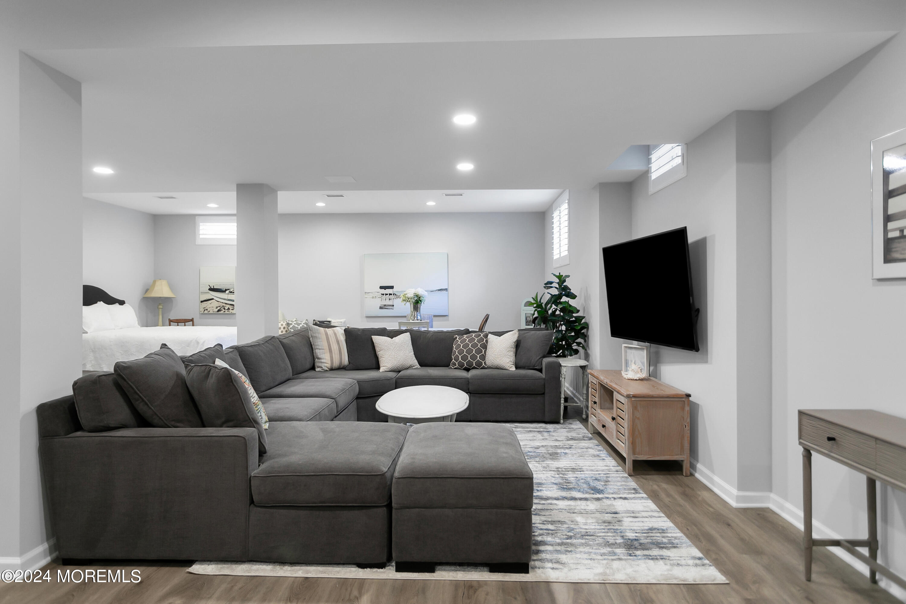 27 Center Street Rumson, NJ 07760 - Photo 40 of 57 a living room with furniture and a flat screen tv