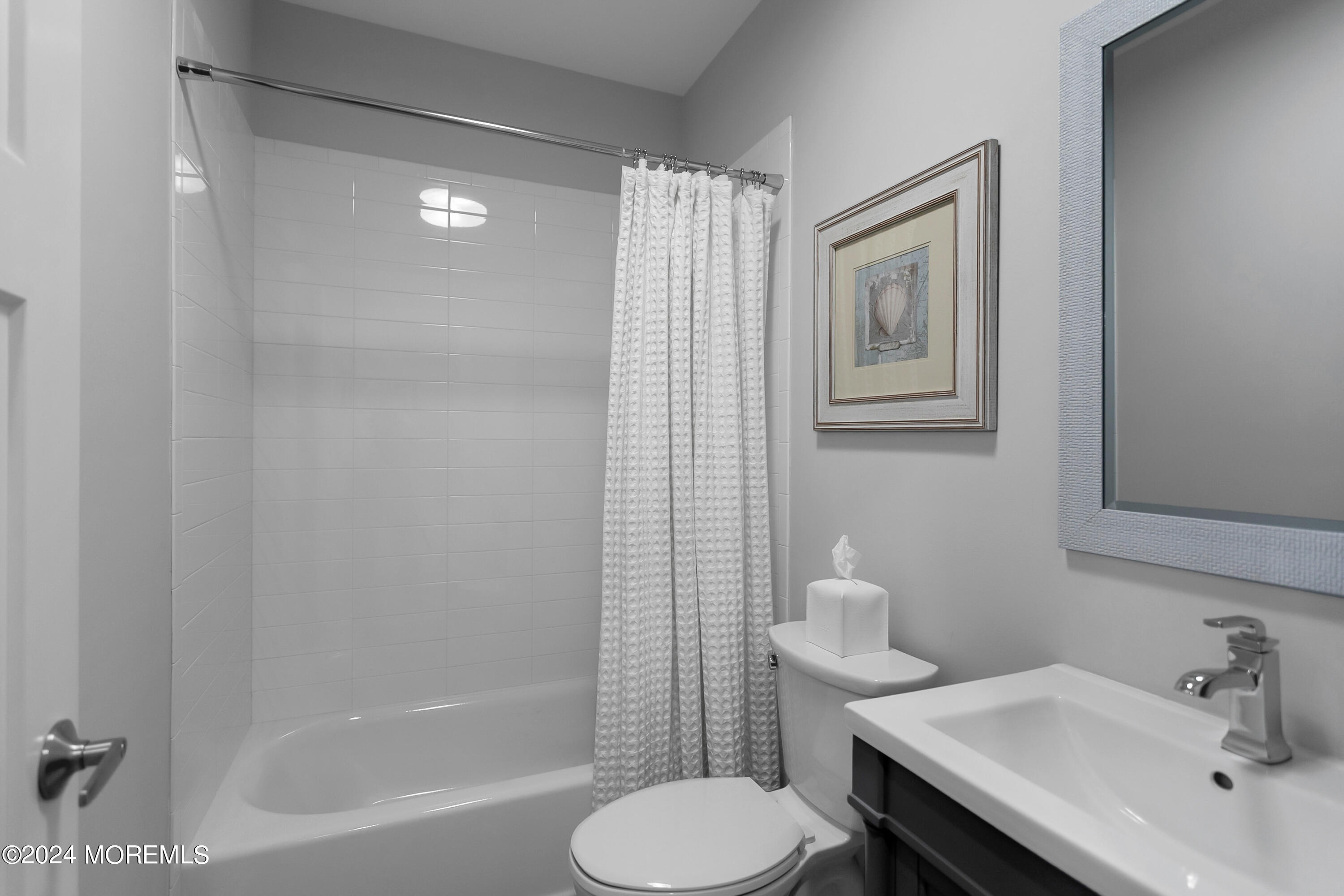 27 Center Street Rumson, NJ 07760 - Photo 43 of 57 a bathroom with a sink toilet and shower