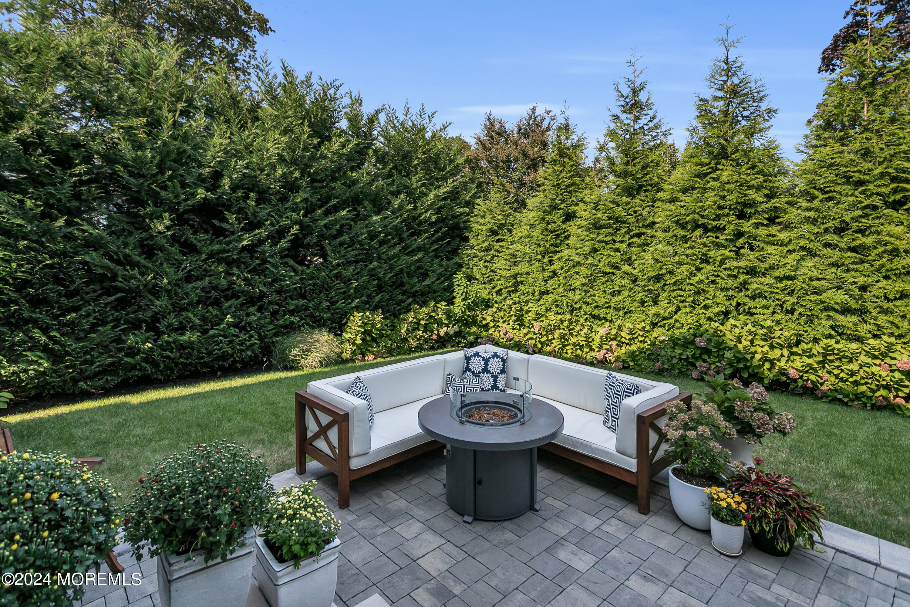 27 Center Street Rumson, NJ 07760 - Photo 45 of 57 a view of a sitting area with furniture and garden