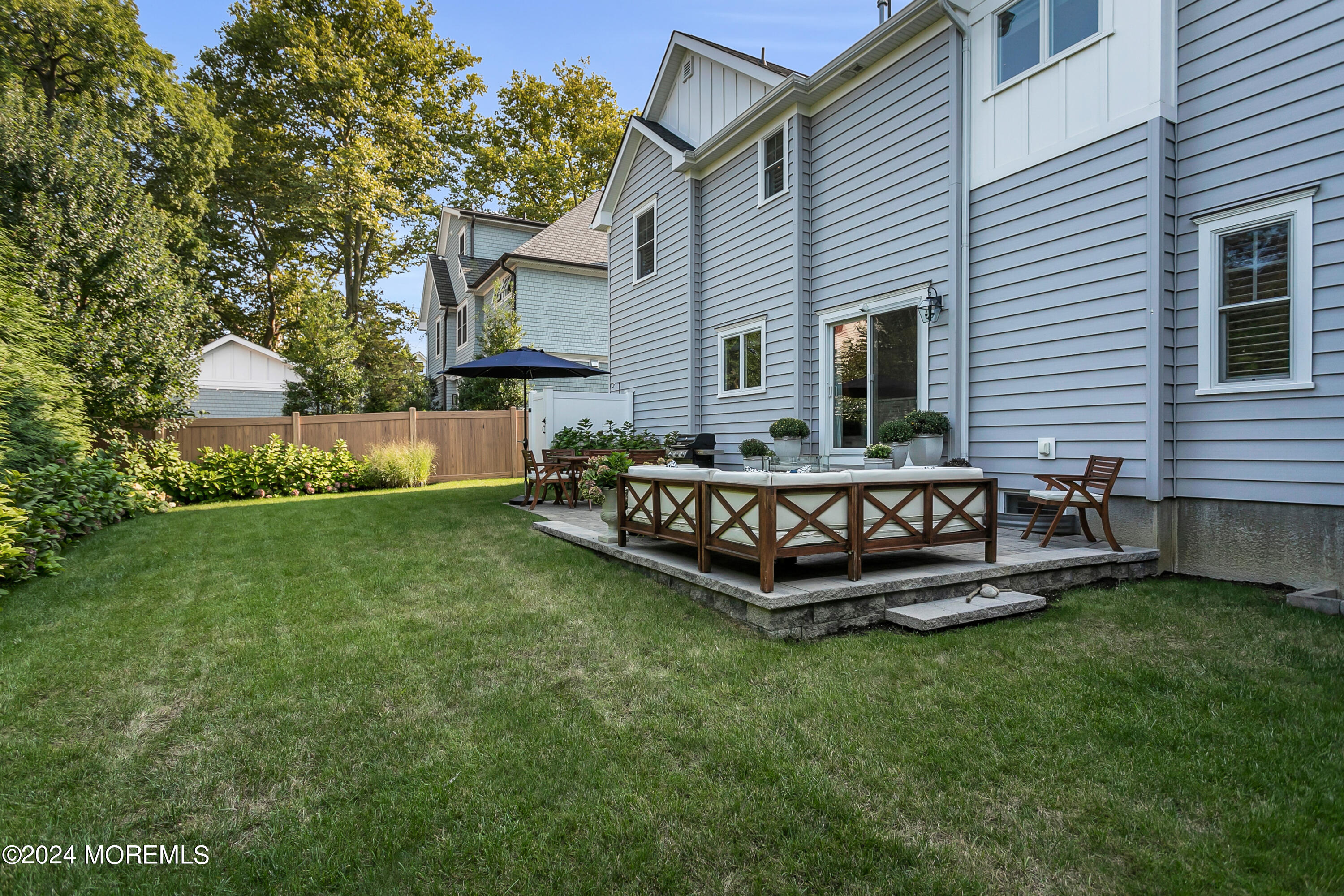 27 Center Street Rumson, NJ 07760 - Photo 47 of 57 a view of a house with a yard and sitting area