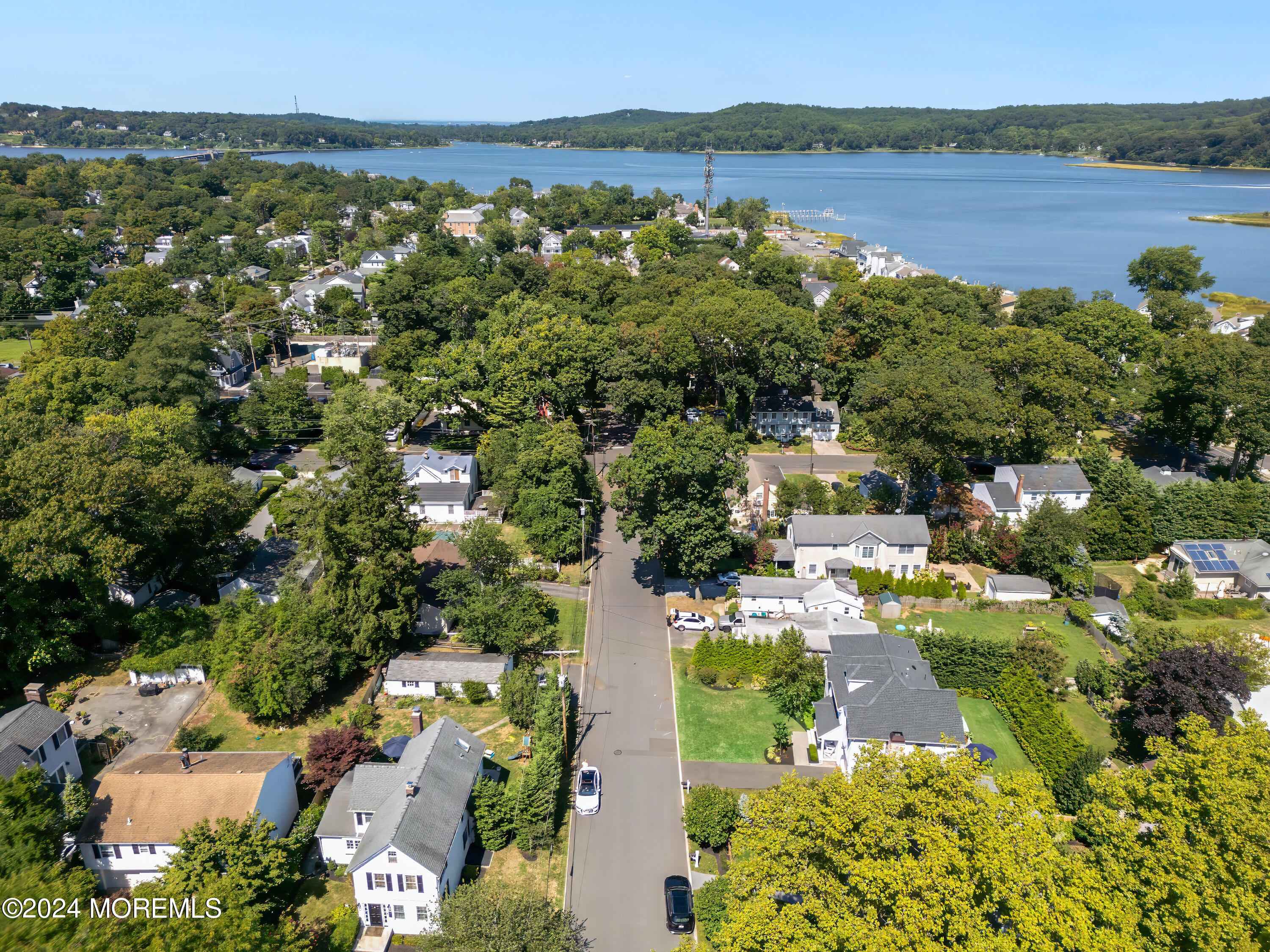 27 Center Street Rumson, NJ 07760 - Photo 51 of 57 an aerial view of residential houses with outdoor space and lake view