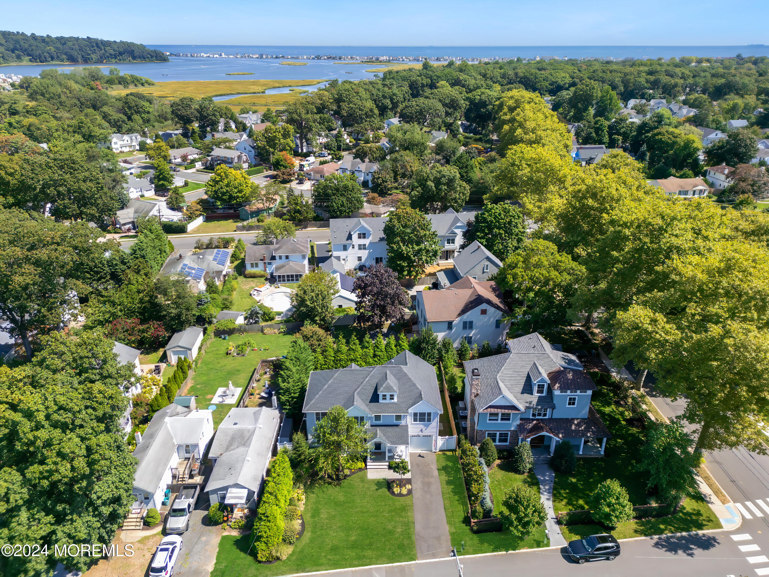 27 Center Street Rumson, NJ 07760 - Photo 57 of 57 an aerial view of residential houses with outdoor space and trees