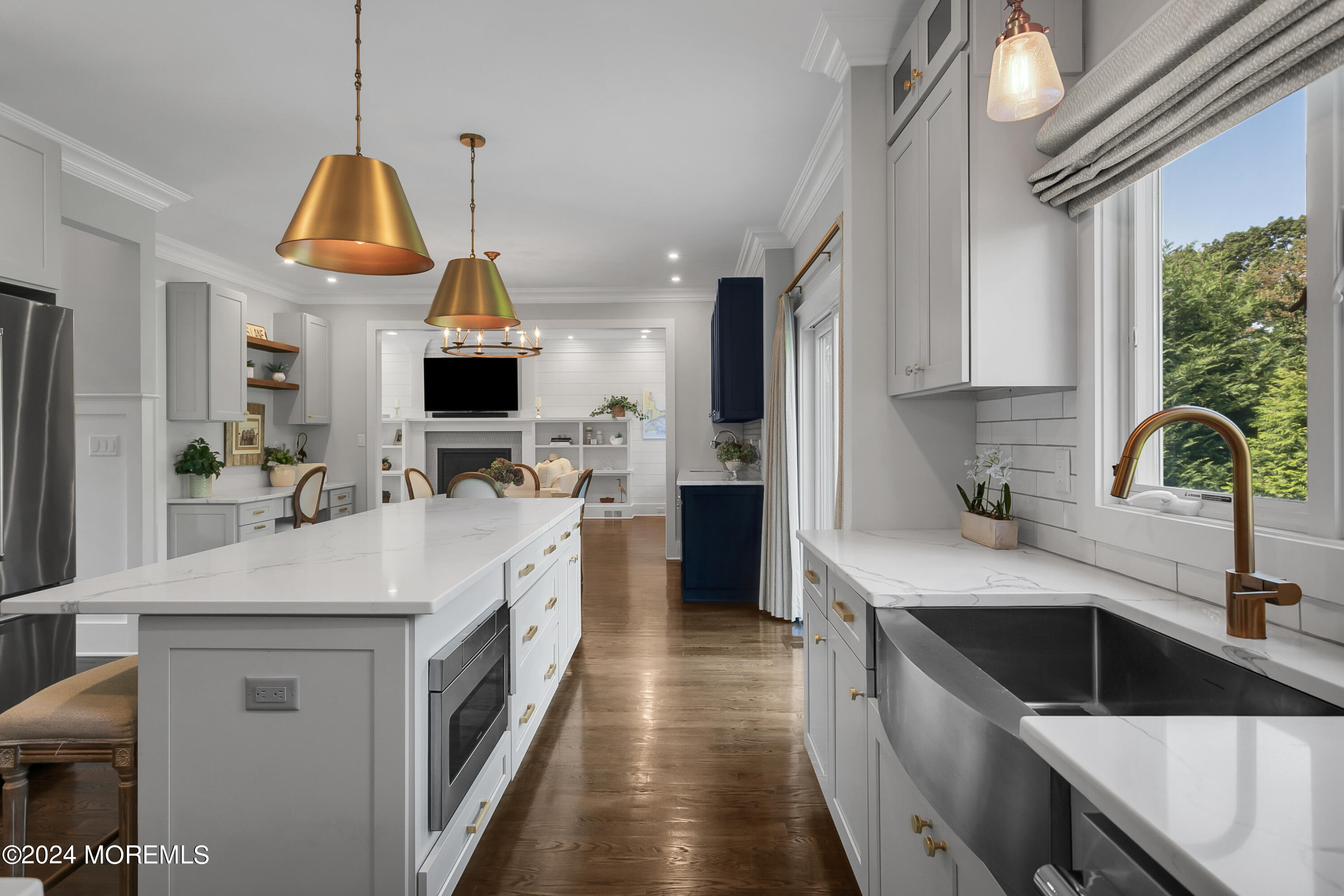 27 Center Street Rumson, NJ 07760 - Photo 10 of 57 a kitchen with a sink a counter top space stainless steel appliances and a window
