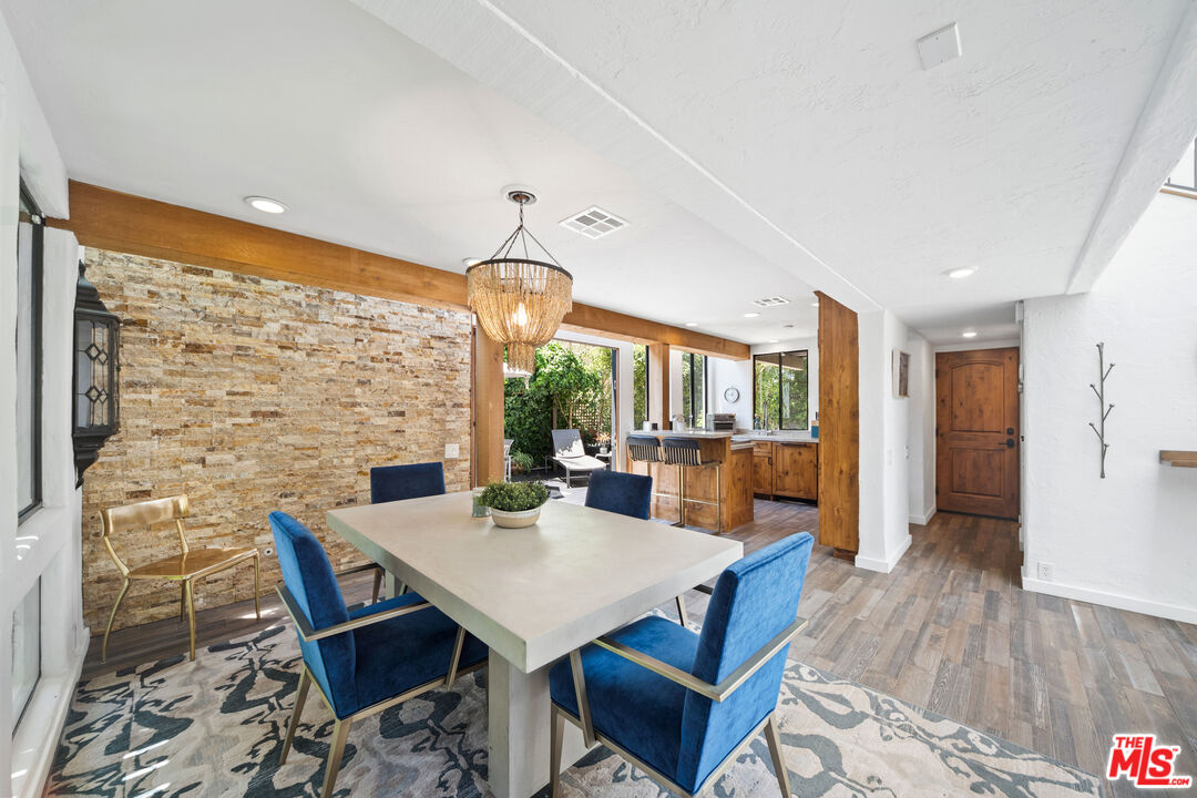 31830 Broad Beach Road Malibu, CA 90265 - Photo 12 of 40 a view of a dining room with furniture window and wooden floor