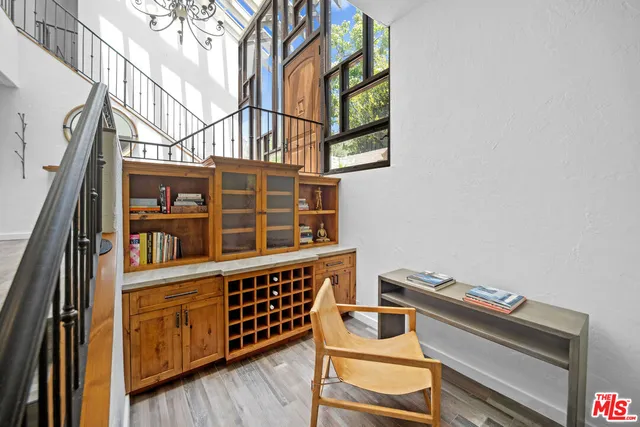 a view of a chair and table in the balcony