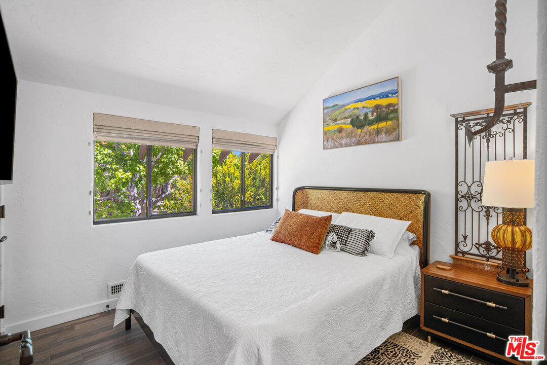 31830 Broad Beach Road Malibu, CA 90265 - Photo 31 of 40 a bedroom with a bed and a window