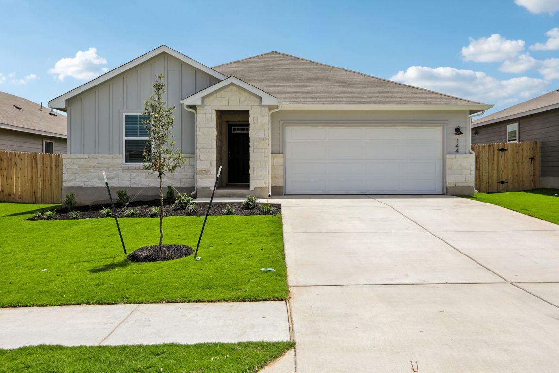 144 Honey Bee Road Jarrell, TX 76537 - Photo 1 of 1 a view of a house with a yard potted plants and a table