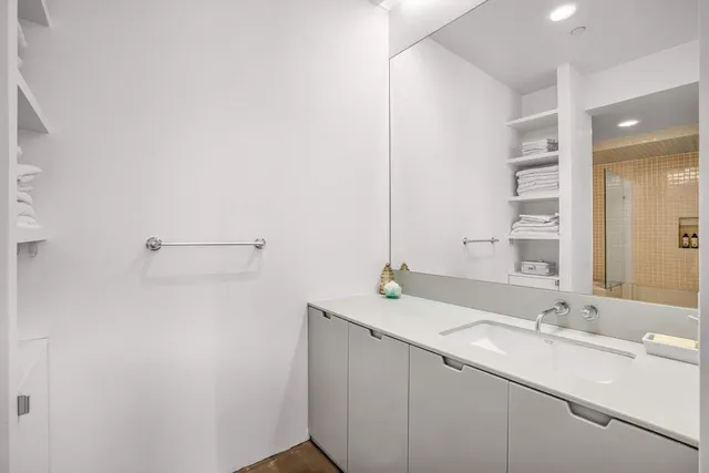 a white toilet sitting next to a bath tub