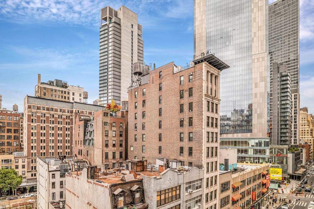 11 West 30th Street, Unit 8F Manhattan, NY 10001 - Photo 4 of 20 a view of a city with tall buildings